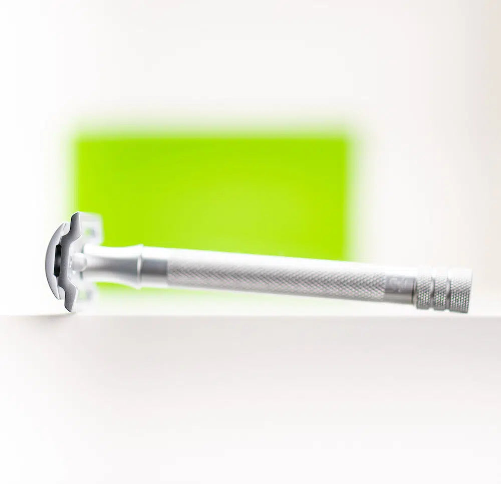 Safety razor on branded background