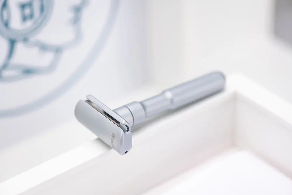 Safety razor on branded background