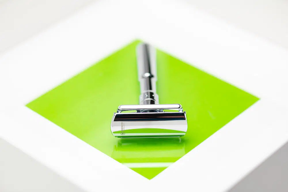 Safety razor on branded background