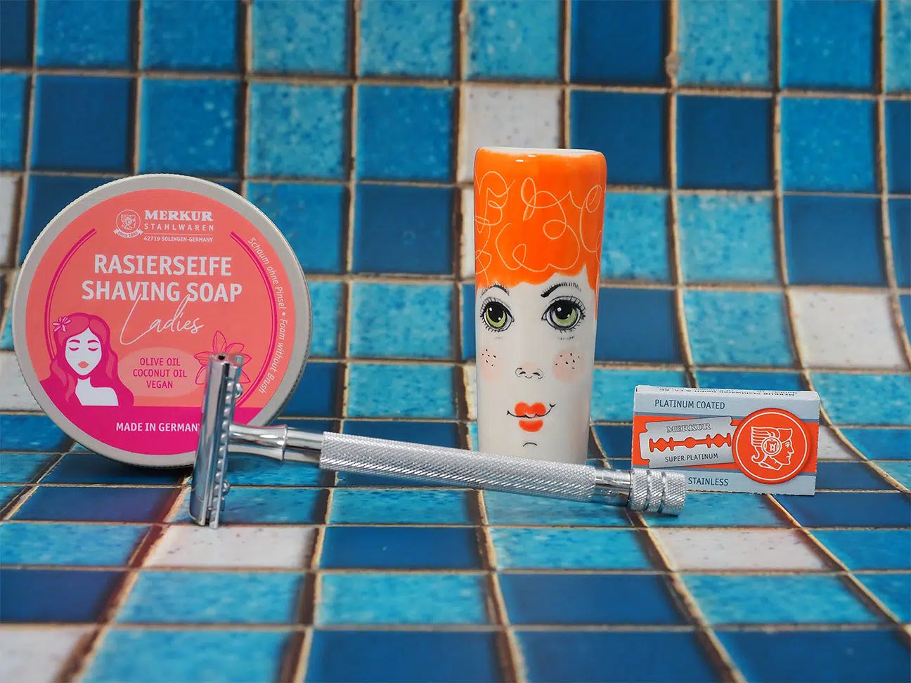 Safety razor on branded background